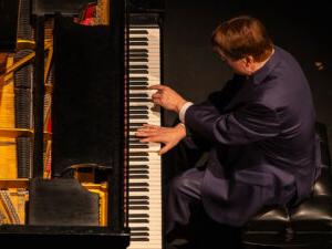 Overhead view of man playing piano